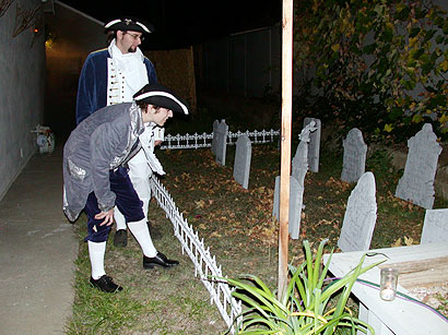 Kael and Lisa inspecting gravestones
