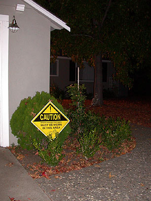 Caution - Masks or Costumes Must Be Worn In This Area!